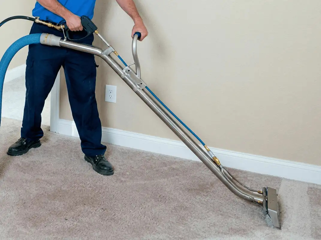 Professional operating a liquid removal machine on a carpeted floor in New Orleans, LA