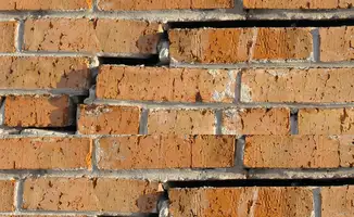 Brick wall with serious structural damage in New Orleans, LA